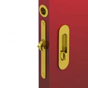 Ambiance image of our mortise lock kit – Round finger pull and oval flush handles with locking device - Steel with golden finish