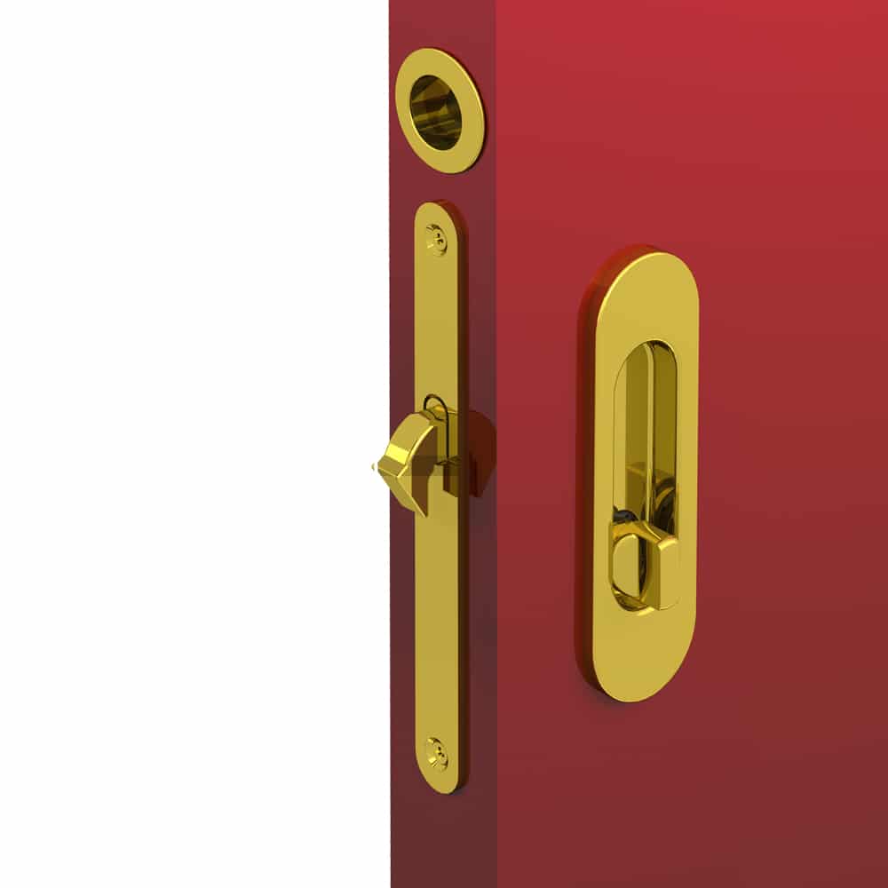 Ambiance image of our mortise lock kit – Round finger pull and oval flush handles with locking device - Steel with golden finish